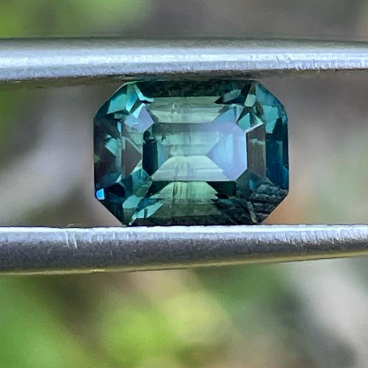 Emerald-cut green sapphire loose gemstone for a bespoke engagement ring
